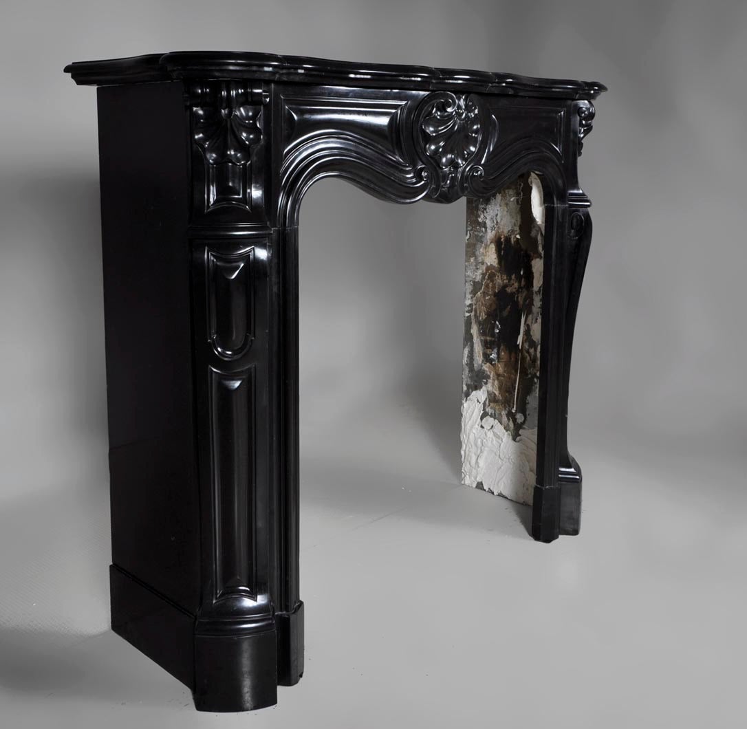 French Small Antique Louis XV Style Fireplace Sculpted in Black Belgian Marble