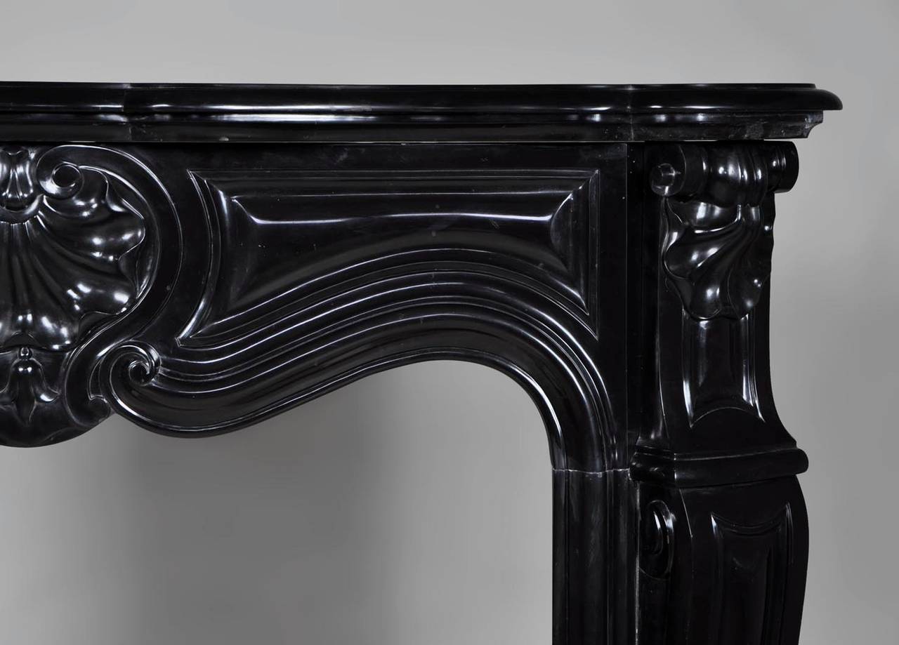 Belgian Black Marble Small Antique Louis XV Style Fireplace Sculpted in Black Belgian Marble