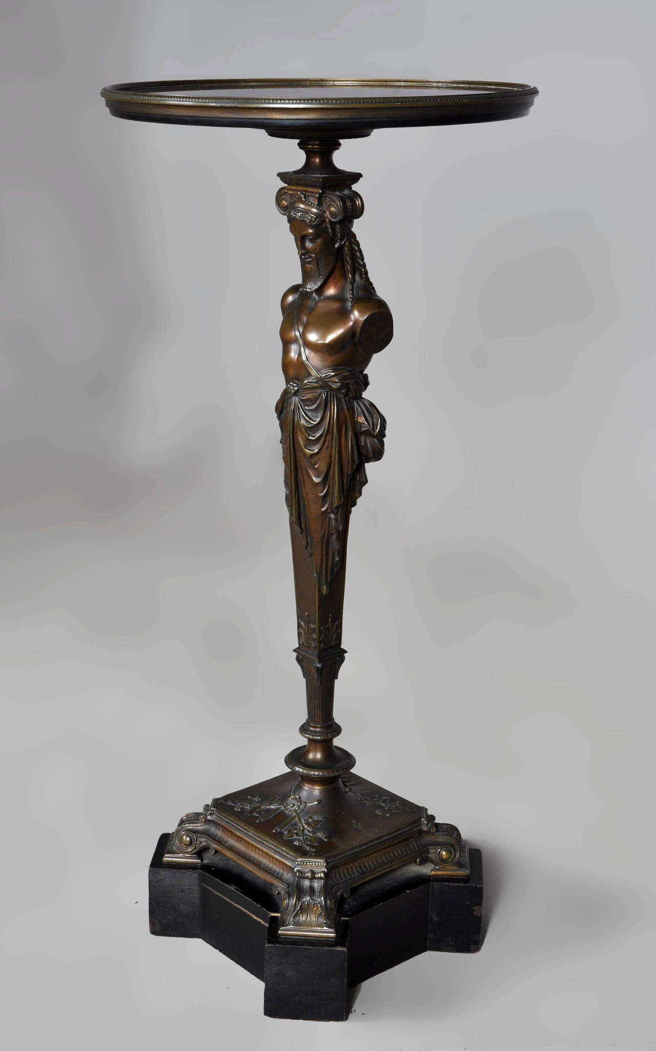 The central leg of this pedestal table figures the god Hermes, made out of brown patina bronze. the base of this table is made out of blackened wood. The top is realized in Black from Belgium marble. 
Beautiful quality of the bronze and chiseling.