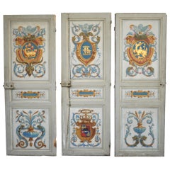 Three painted doors signed and dated "A. Baillty 1914"