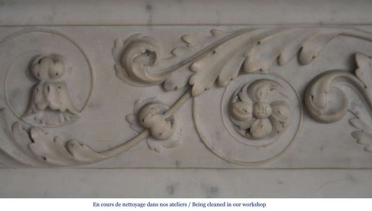 French Antique Louis XVI Style Fireplace with Carved Foliages in Carrara Marble, Period 19th Century