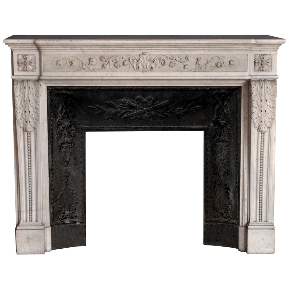 Antique Louis XVI Style Fireplace with Carved Foliages in Carrara Marble, Period 19th Century