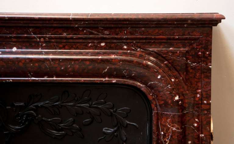 Marble Antique Louis XIV style fireplace made out Red Griotte marble, 19th c.