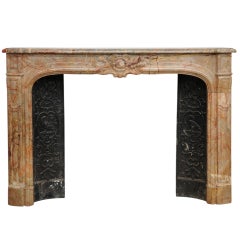 Regence style antique fireplace in Sarrancolin marble