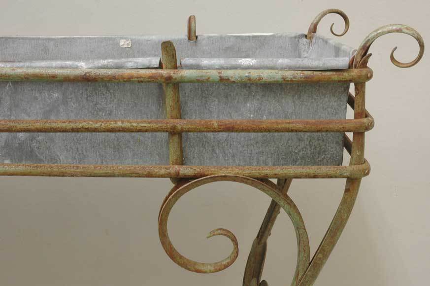This plant stand as realized in wrought iron in the 19th century.