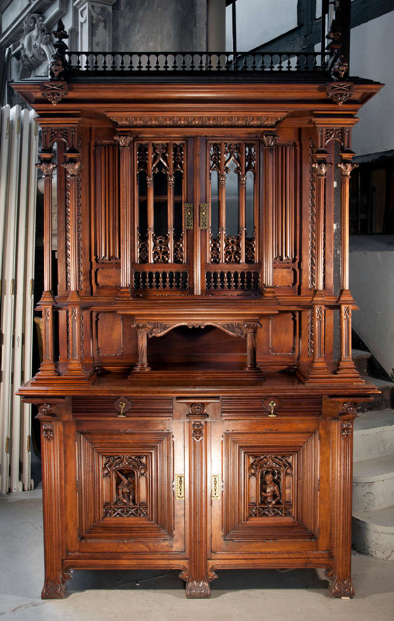 This antique Neo-Gothic style buffet was realized by Leroux, parisian cabinetmaker, in 1882. 
Leroux was a famous french cabinet specialized in Neo-Gothic and Renaissance style furniture. 
The lower part of the buffet is made of two doors carved