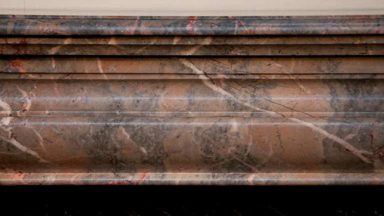 Antique Louis XIV style fireplace made out of Rose Enjugerais marble