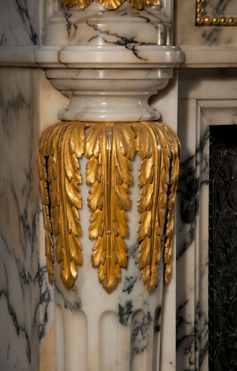 Marble Rare Antique Louis XVI Style Fireplace with Columns and Gilded Bronze Sculptures For Sale