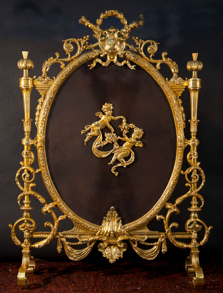 This rare Louis XVI style fire screen was made out of gilded bronze in the late 19th century. The fireplace is stamped by the parisian bronze manufacturer Charles Casier. The fire screen is stamped 