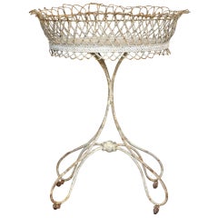 Antique oval plant stand in wrought iron,