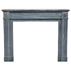 Antique Louis XVI style fireplace made out of Bleu Turquin marble