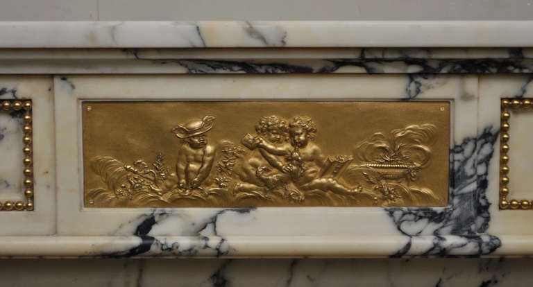 French Louis XVI style antique fireplace in Panazeau marble and bronze