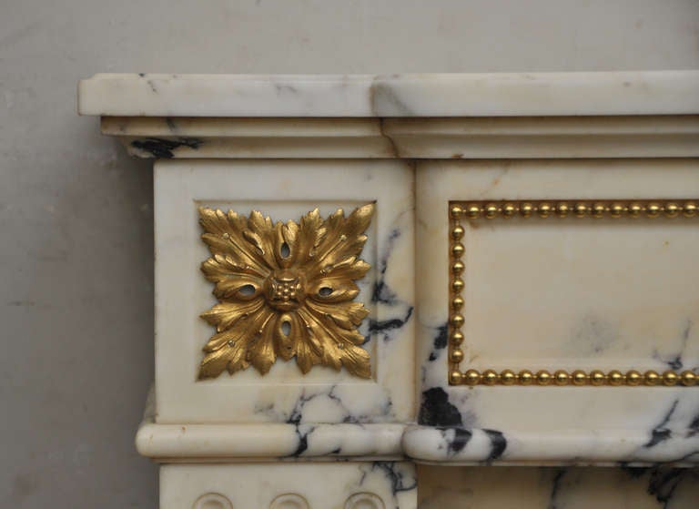 19th Century Louis XVI style antique fireplace in Panazeau marble and bronze