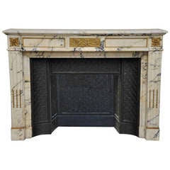 Louis XVI style antique fireplace in Panazeau marble and bronze