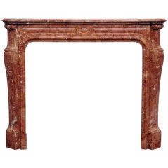 Louis XV style fireplace in Rouge Alicante marble