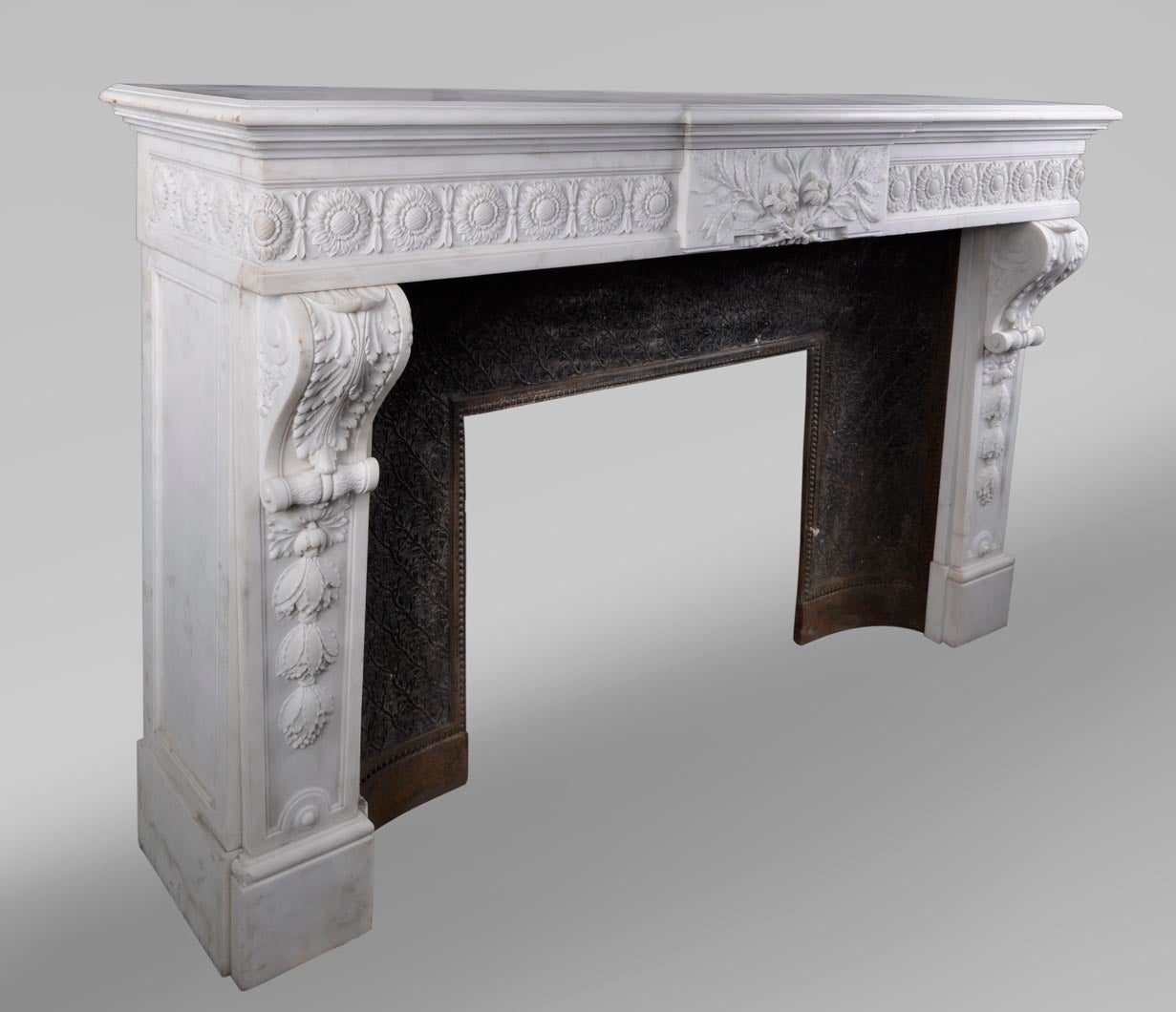 Carved Louis XVI style fireplace after the model from the Petit Trianon, 19th c. For Sale