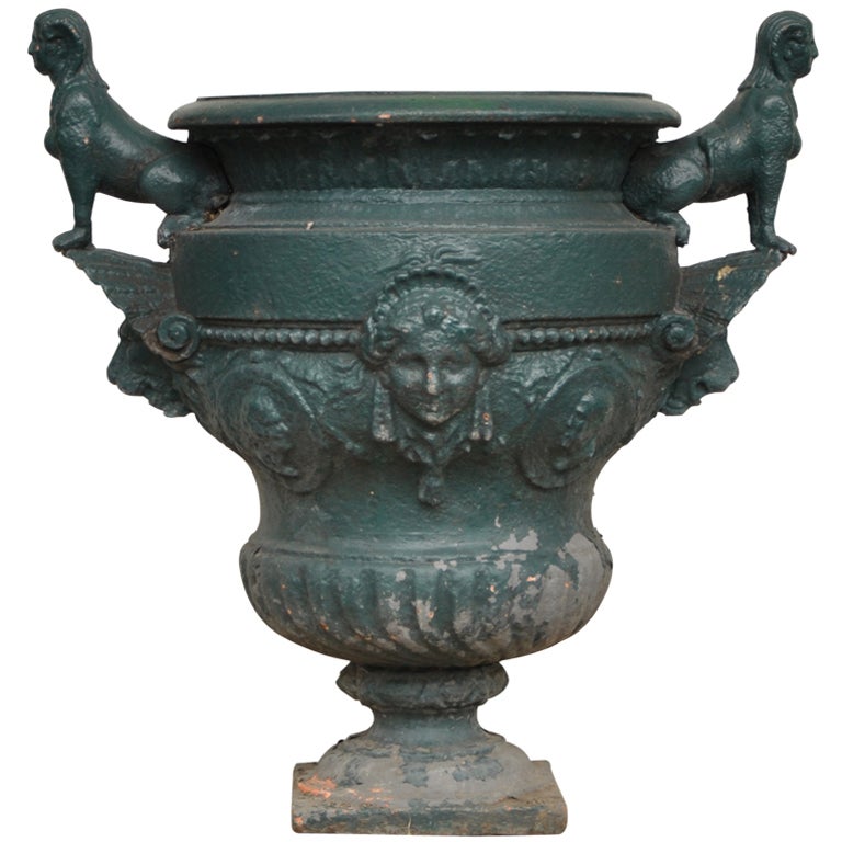 Antique cast iron vase with two sphinxes For Sale