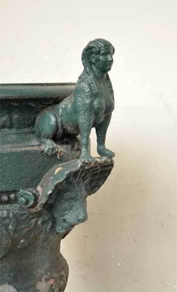 Iron Antique cast iron vase with two sphinxes For Sale