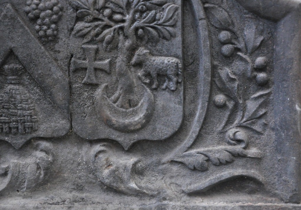 Iron Cast iron fireback from the 18th century with coat of arms