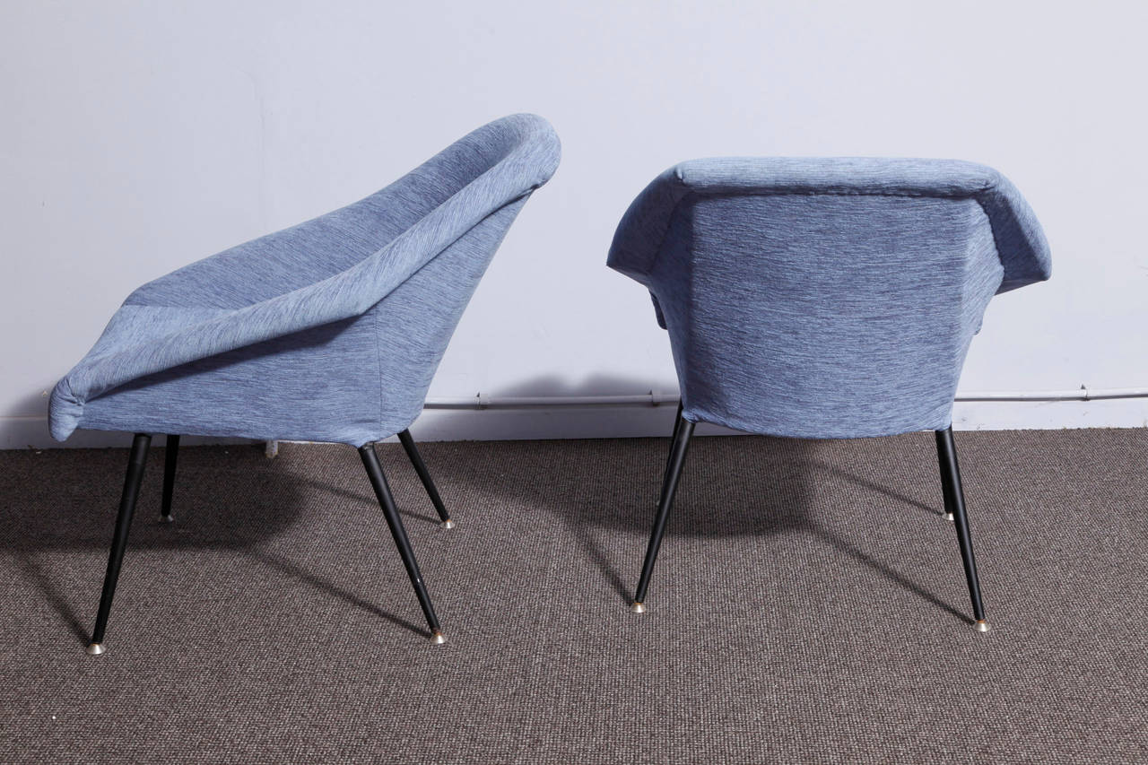 A pair of Italian origin armchairs from 1950. Black painted metal frame and new, blue colored upholstery.