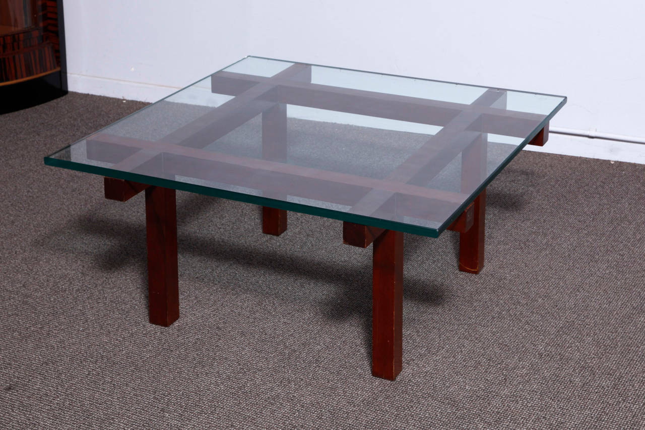 A very elegant solid wenge wood sofa table with glass top, designed by Alfred Hendrickx.