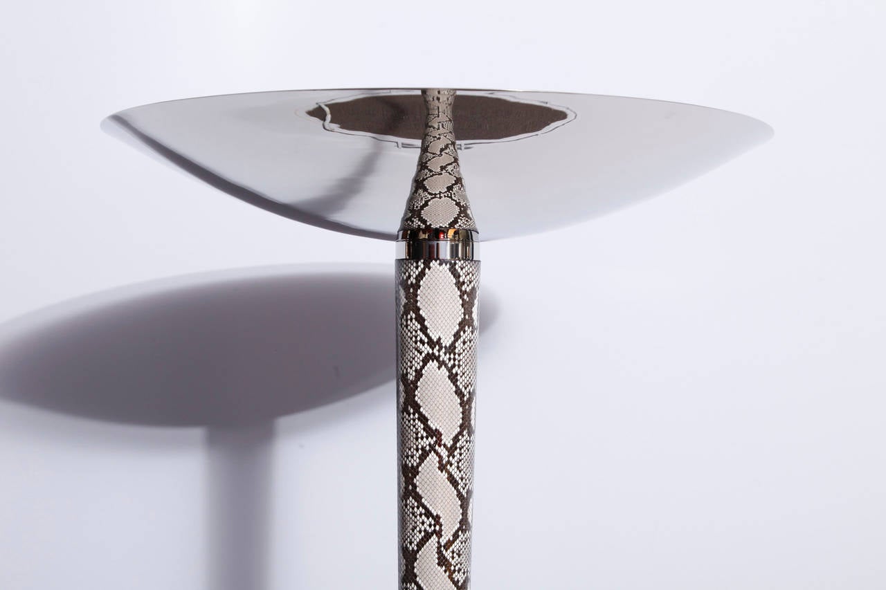An exceptional  Art Deco torcher in nickel-plated brass structure and shade. The central tube is recovered with a snake's skin. A very elegant and decorative piece.
