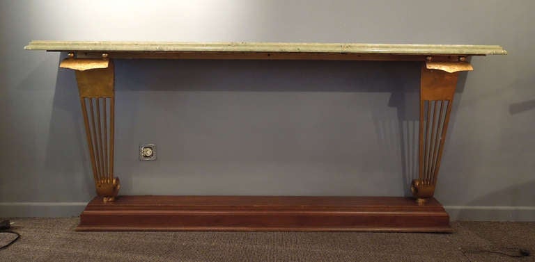A very exceptional art-deco console table.Wooden base, gilded forged iron , green coloured marble top.