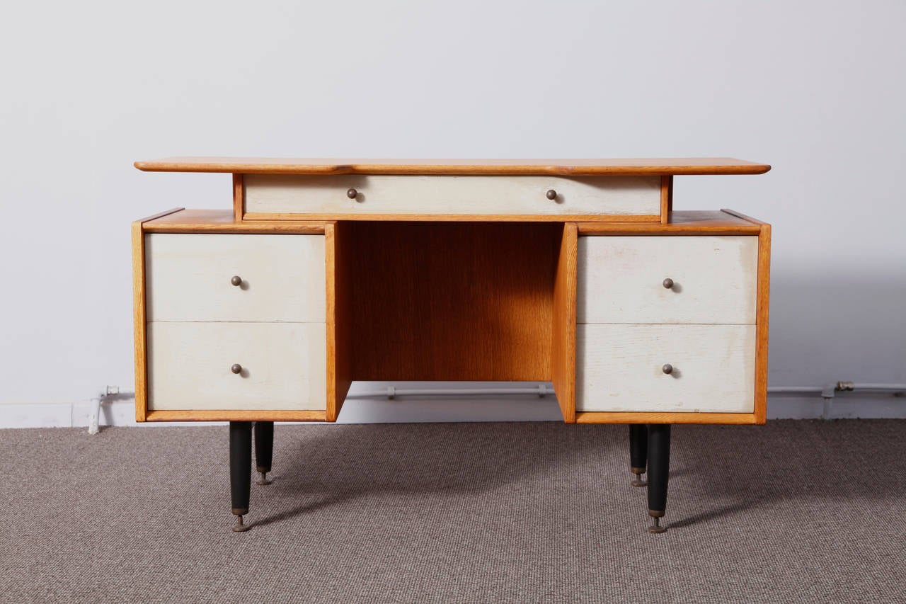 Solid oak desk in the manner of Ib Kofod-Larsen, edited by G Plan.
The drawers are painted and desk was restored recently.