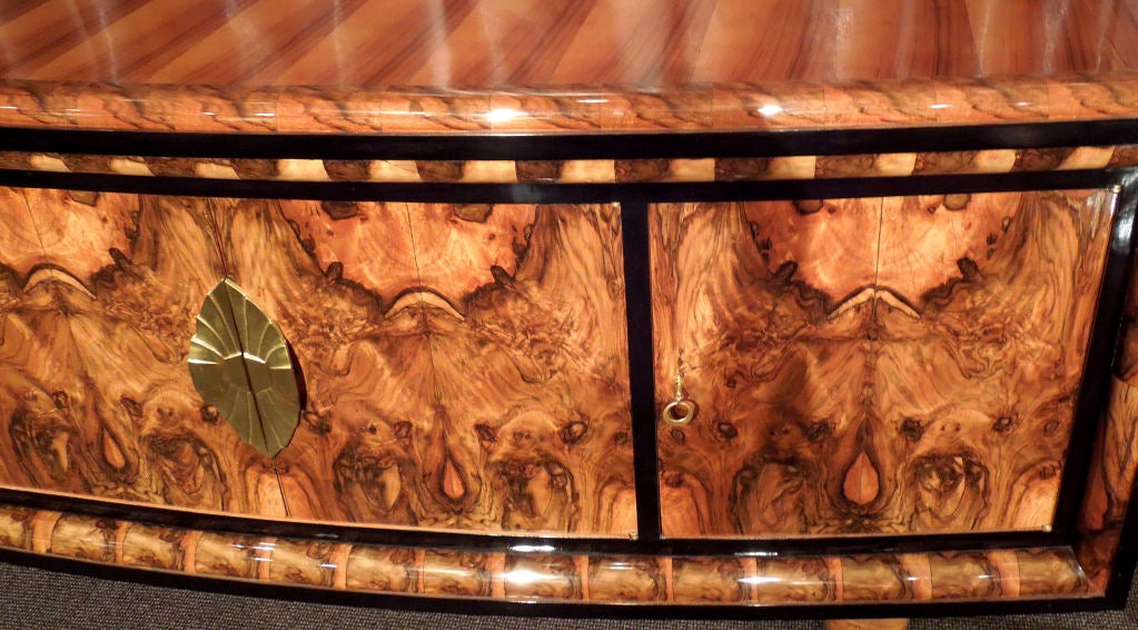 Italian origin burled walnut veneered art-deco sideboard.Brass hardware.French polish.A very elegant piece.