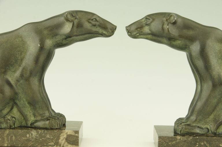 A pair of patinated metal bookends in the shape of polar bears by the French artist M. Font. 
The bookends have marble bases. 
Size of one: H. 16,5 cm. x L. 19 cm. x W. 8 cm. 
or 6.5 inch x L. 7.5 inch x W. 3.5 inch

Shipping $ 80. 