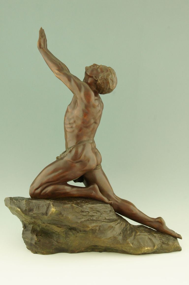 Impressive size for this bronze sculpture of a male nude on a rock. Signed by Claire Jeanne Roberte Colinet. 

This model is illustrated on page 106 of
Art deco and other figures by Brian Catley, Antique collectors club.

More information about
