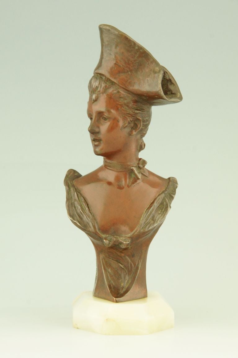 Art nouveau bust by Georges van der Straeten. 
This model was sold at Tiffany's New York.
The bronze is signed and has a foundry seal. 

This model is illustrated:
picture number 1232 of 
“Bronzes, sculptors and founders” by H. Berman,