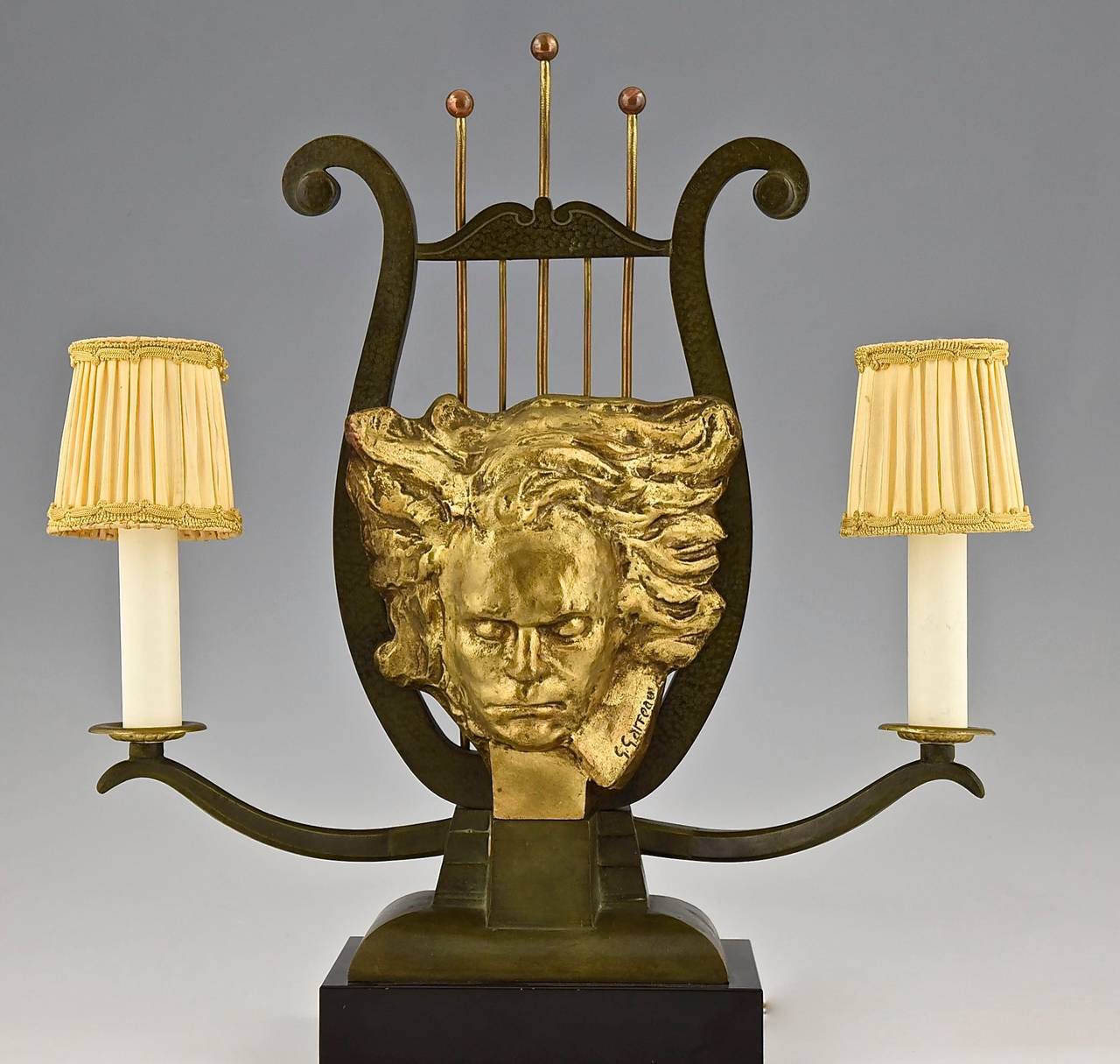 Art Deco bronze lamp with the head of Beethoven.
By Georges Raoul Garreau.
Style: Art Deco.
Condition: 
Good original condition. 
Rewired for European electricity.
An adapter plug will be provided.
Date: circa 1935.
Material: Bronze with
