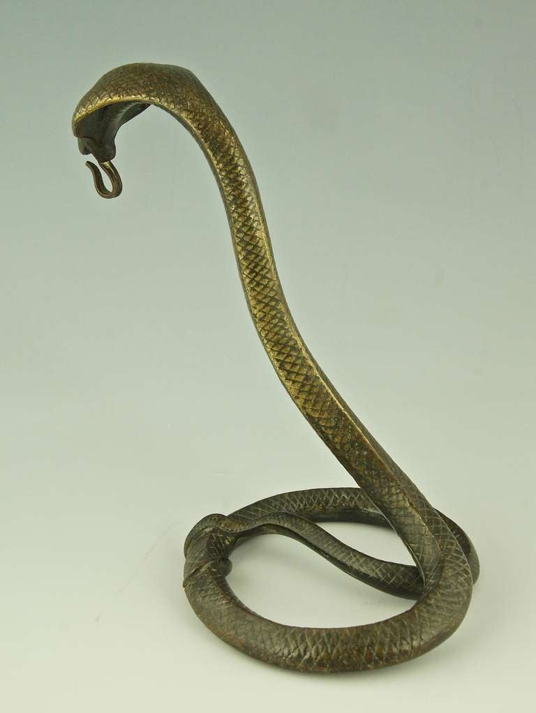 A Bronze Art Deco Cobra Pocket Watch Stand by Edgar Brandt 1