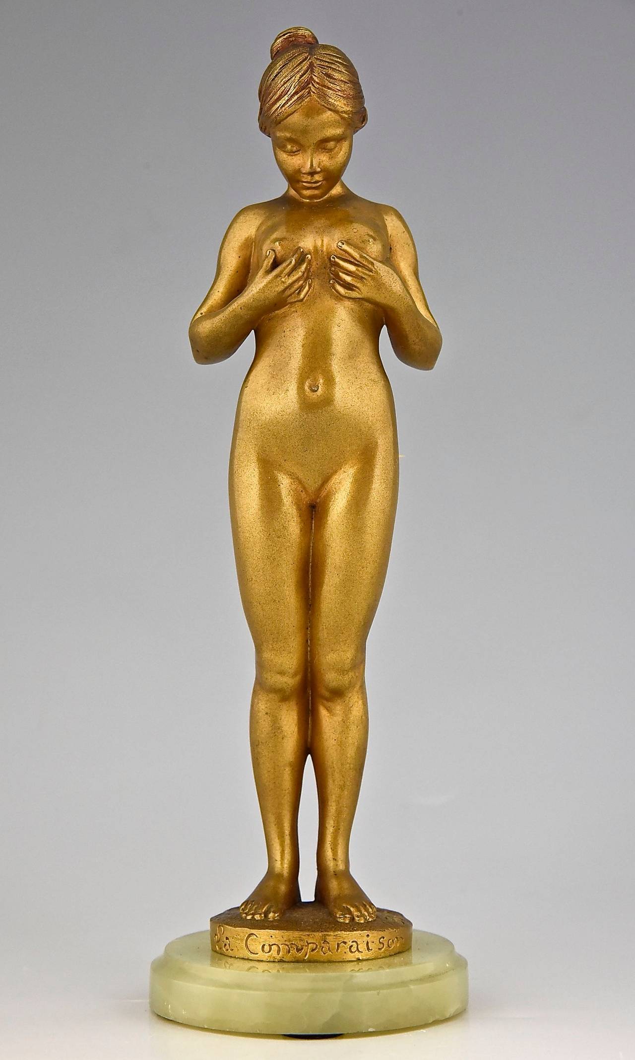“La comparaison”. 
A bronze of a young girl comparing her breasts. 
By Antoine Bofill.
Worked in France 1895-1925.
Signature & Marks:  Bofill.  Patrouiileau éditeur, Paris.  Bronze. 
Style:  Art Nouveau. 
Date:  1905. 
Material:  Gilt bronze.
