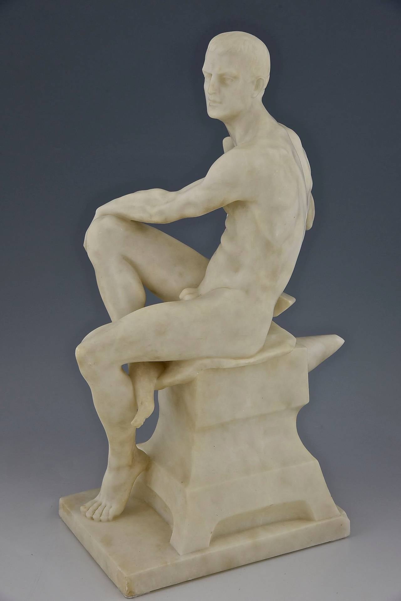 Antique marble sculpture of a seated male nude with a hammer sitting on an anvil.
By Franz Iffland.
Signature and marks:  Fec. Iffland. 
Style: Romantic. 
Date:  1890. 
Material: White marble. 
Origin:  Germany. 
Size:  
H 19.3 inch x L 11.4