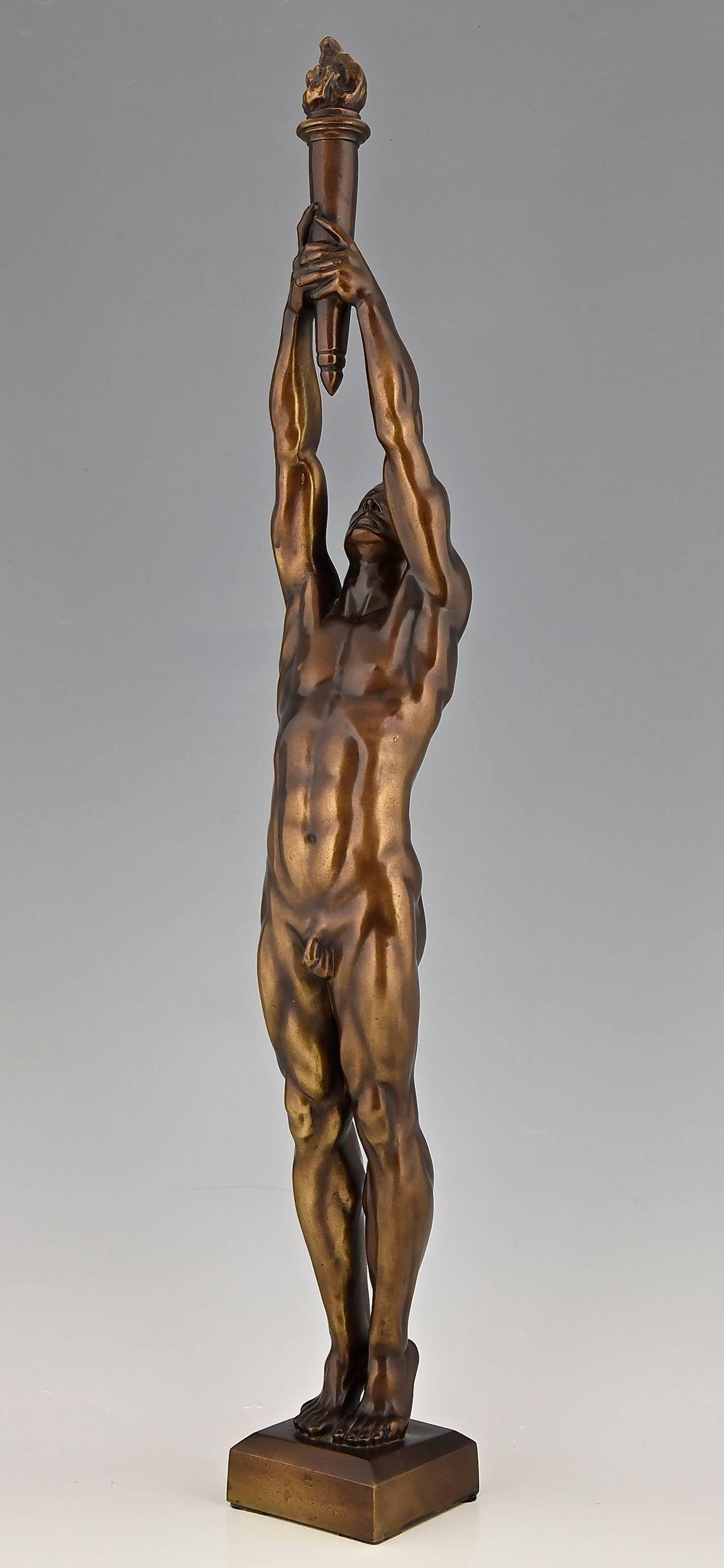 Bronze sculpture of a male nude holding a flaming torch. This is the reduced version of the monument for Francisco Ferrer in Brussels and Barcelona.
By Auguste Puttemans (1866-1922).
Signature and marks:  A. Puttemans 1912.
Date: 