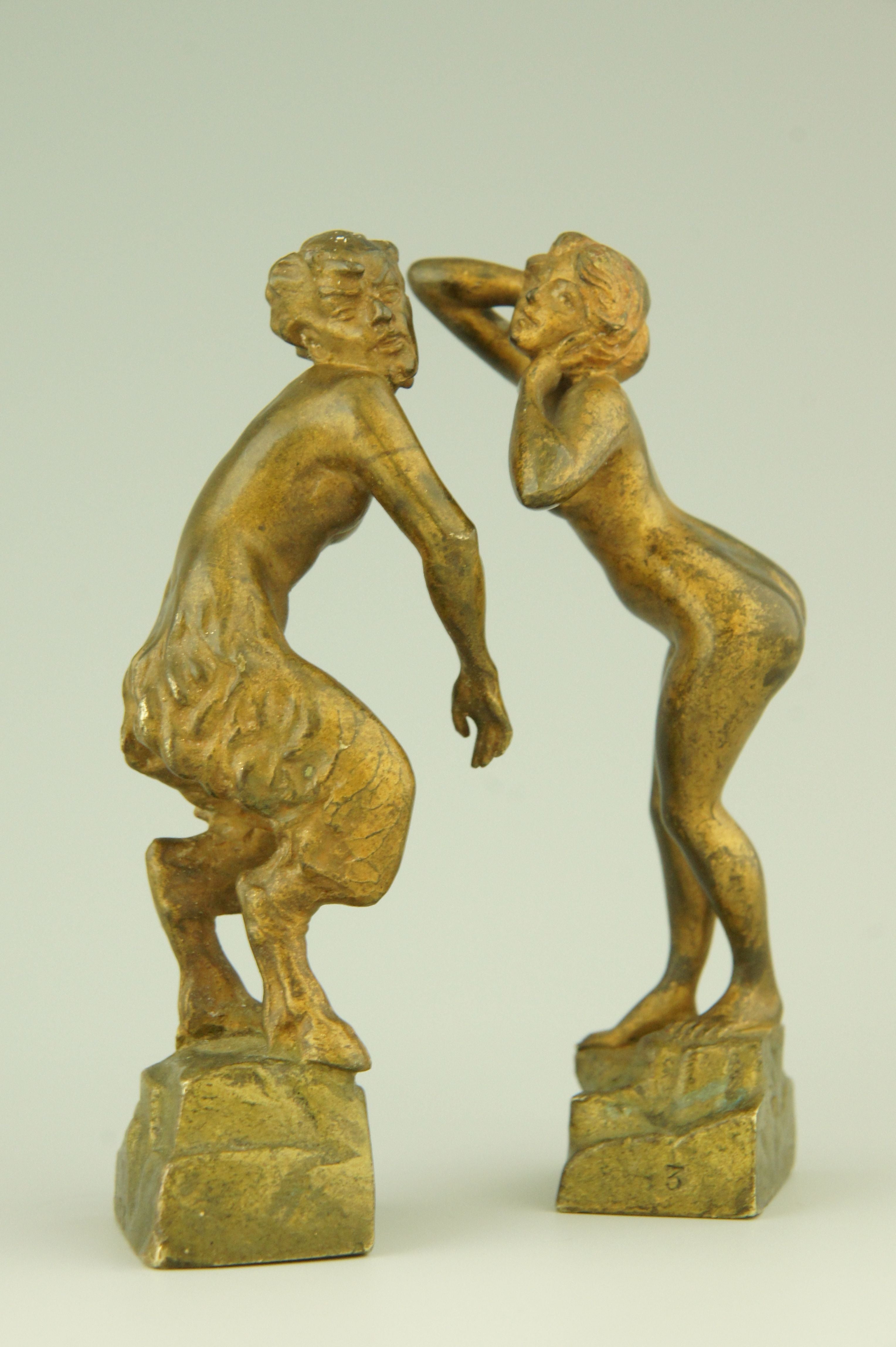 A pair of naughty Vienna bronzes of a nymph and a satyr.