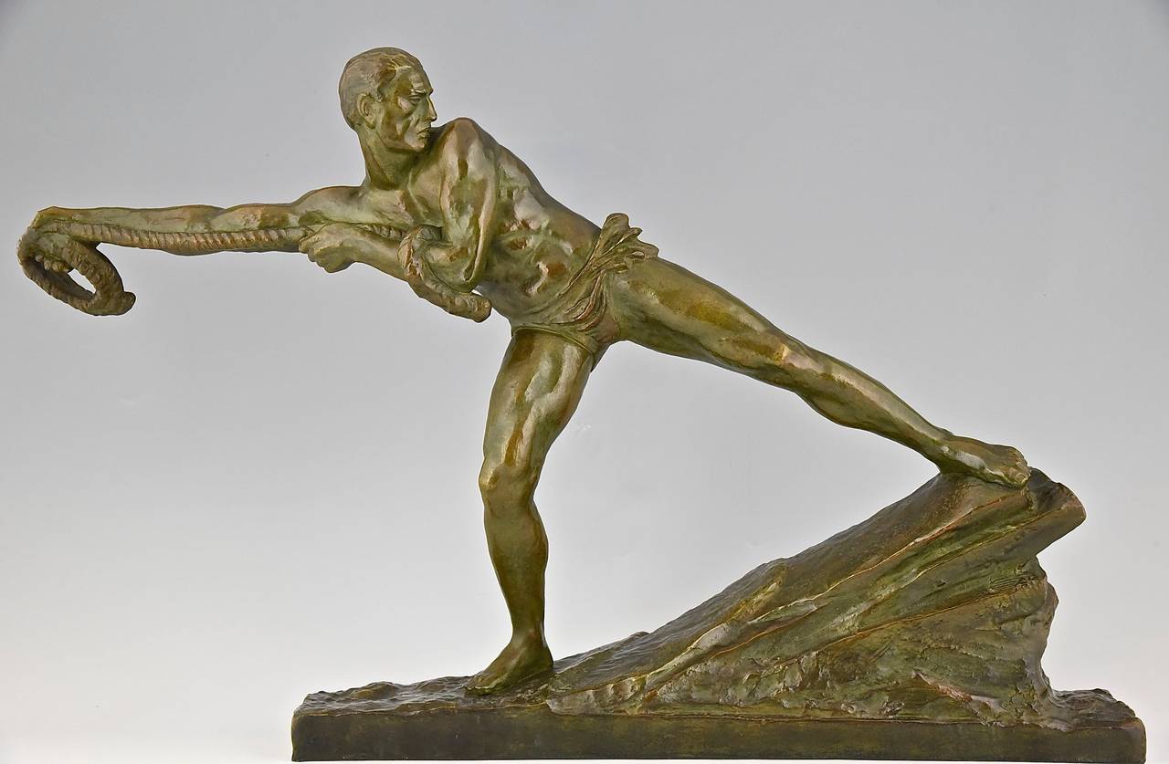 Art Deco bronze of an athletic man pulling a rope.
By Pierre  Le Faguays, signed. 
Bronze. 
Edited by “Les Neveux de Lehmann” Seal LN Paris JL.
Style: Art Deco.
Condition:  Excellent condition.
Date: circa 1930.
Material: Bronze, dark green