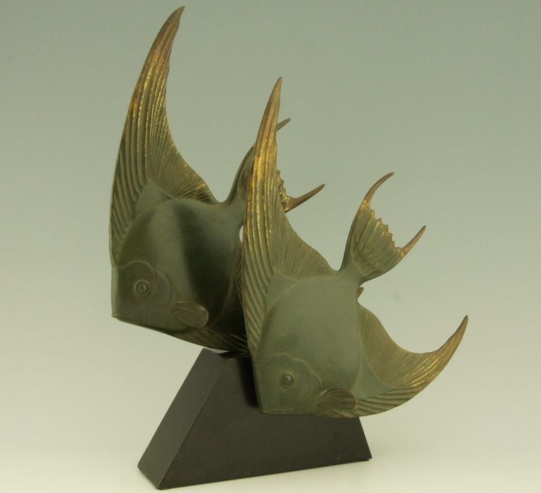 Art Deco bronze sculpture of two Angelfish by Georges Lavroff. Born in Russia in 1895, lived and worked in France. 
Signature: G. Lavroff. Stamped  Bronze. 
 Bronze with multicolor patina on a stepped black marble base.  

Literature:
This