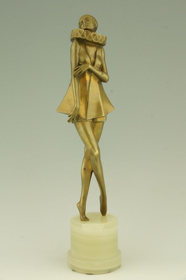 Elegant Art Deco sculpture of a woman with stylized Pierette costume. 
By Joseph Lorenzl. 
Signature:  Lorenzl and stamped numbers. 

Literature:  
“Art deco sculpture” by Victor Arwas, Academy.
 “Art deco and other figures” by Brian Catley,