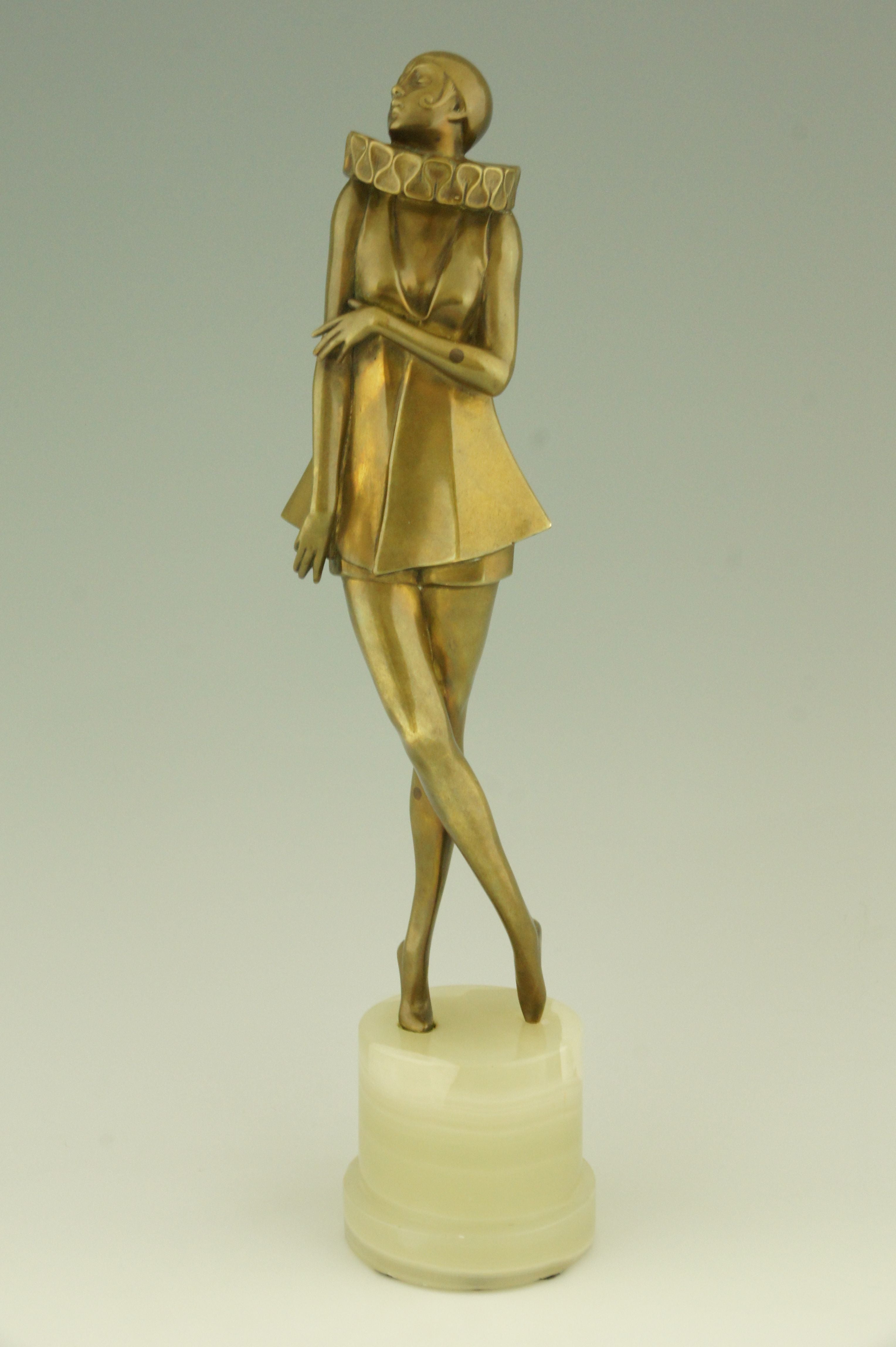 Art Deco bronze sculpture of a woman with stylized costume by Lorenzl. 