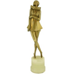 Art Deco bronze sculpture of a woman with stylized costume by Lorenzl. 