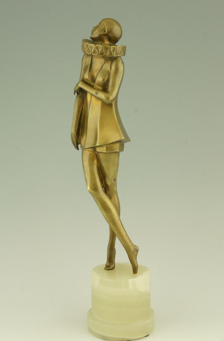 Austrian Art Deco bronze sculpture of a woman with stylized costume by Lorenzl. 