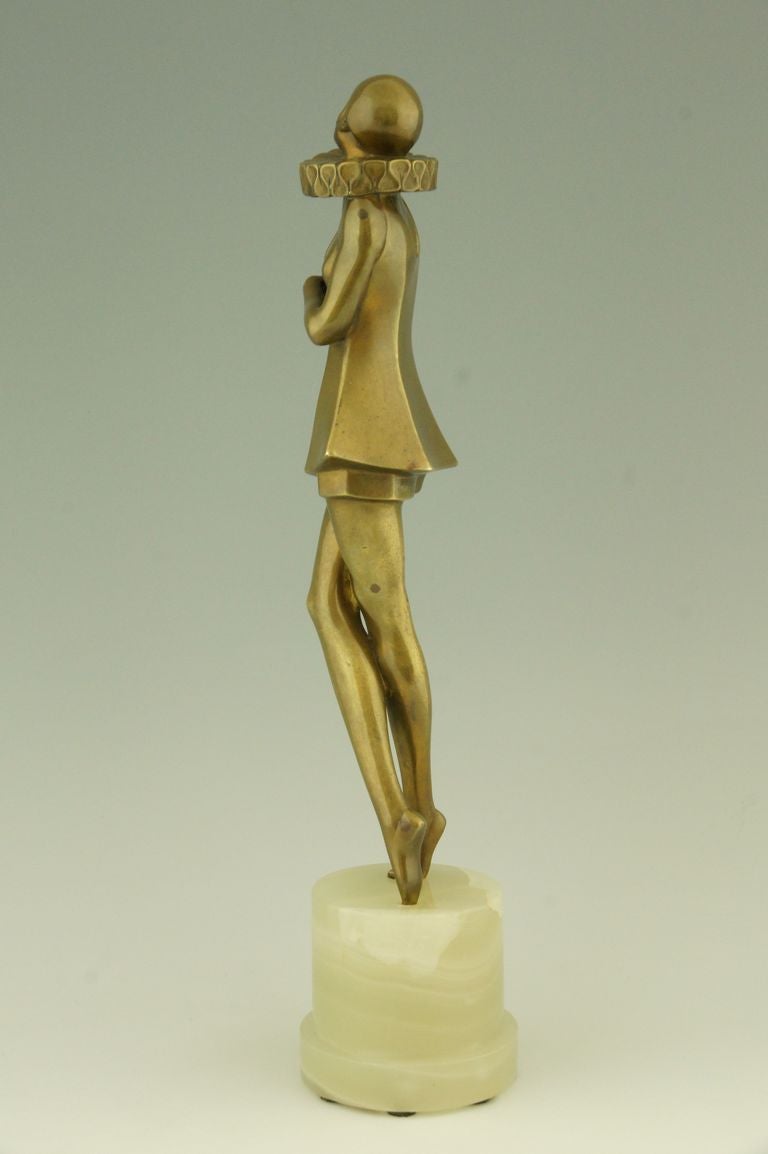 Art Deco bronze sculpture of a woman with stylized costume by Lorenzl.  In Good Condition In Antwerp, BE
