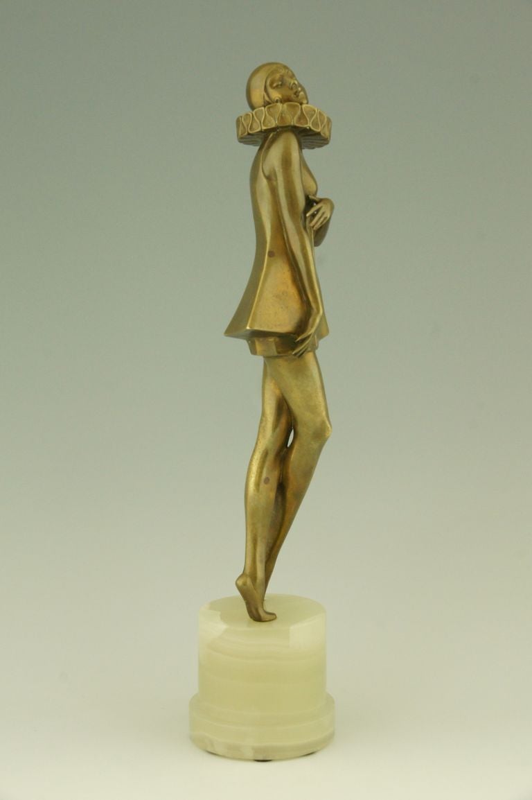 Bronze Art Deco bronze sculpture of a woman with stylized costume by Lorenzl. 