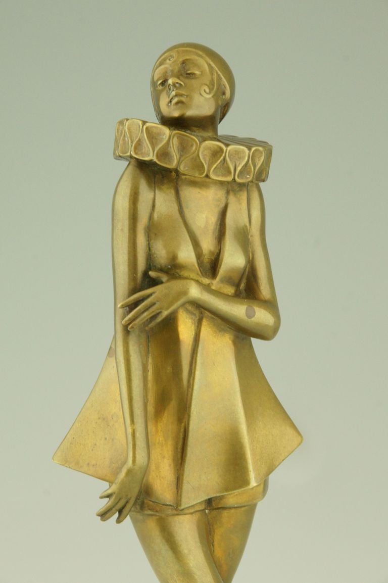 Art Deco bronze sculpture of a woman with stylized costume by Lorenzl.  1
