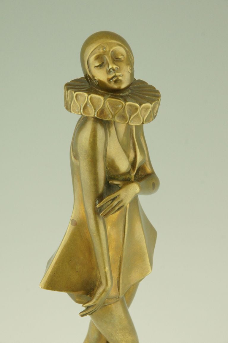 Art Deco bronze sculpture of a woman with stylized costume by Lorenzl.  2