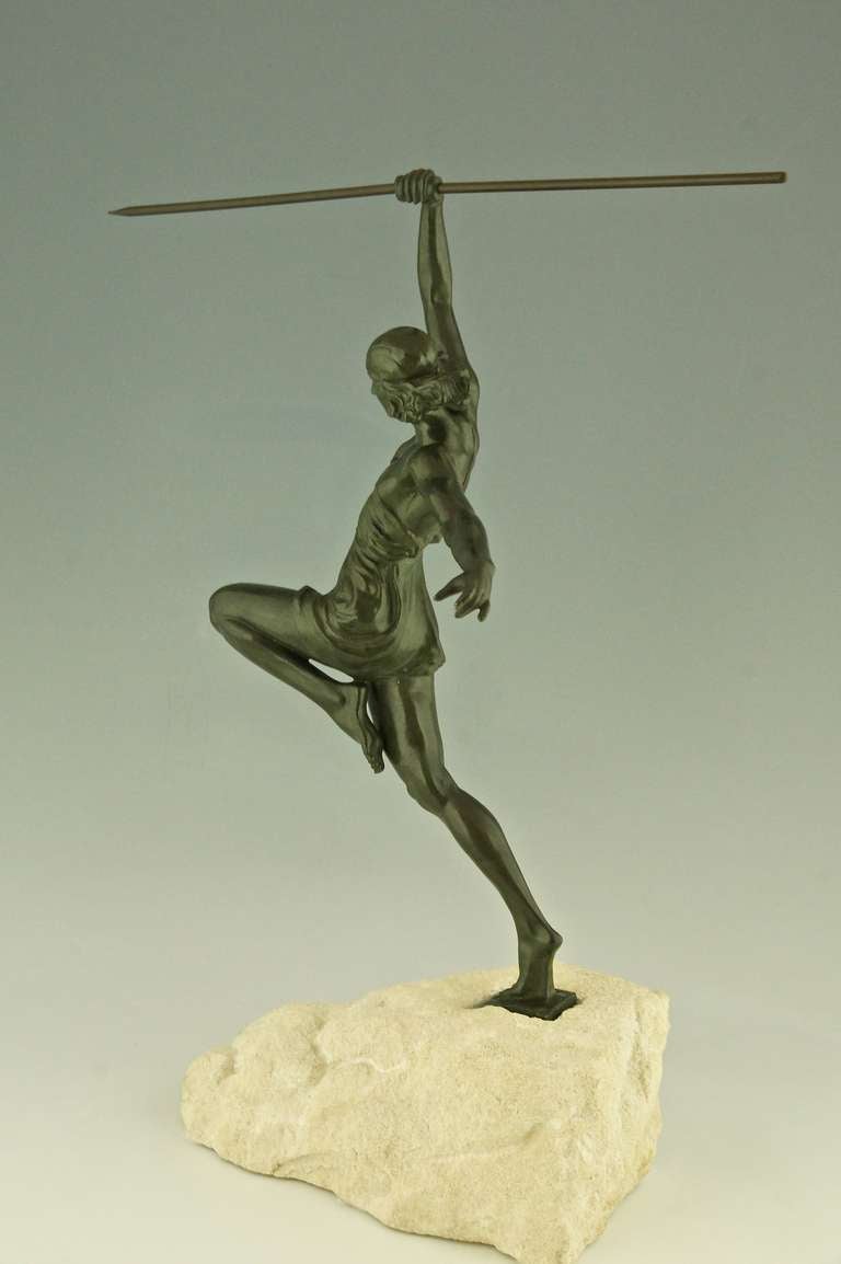 Art Deco metal sculpture of a female javelin thrower.
“Amazone au javelot”
By  Pierre Le Faguays.
Signature in the base: P. Le Faguays. 
Style: Art deco.
Condition:  Good original condition.
Date: Ca. 1935.
Material: Metal, green