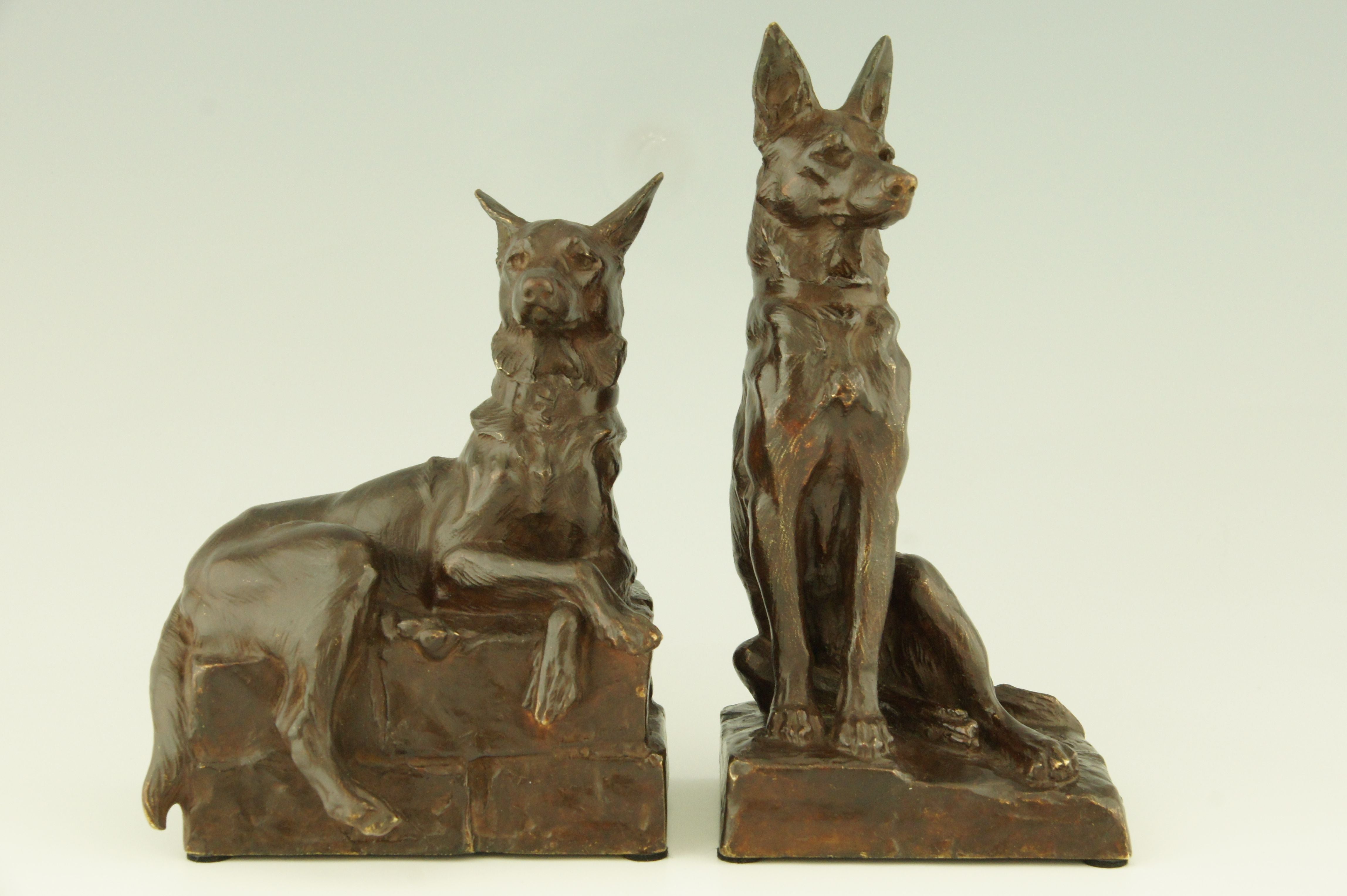 A pair of bronze shepherd dog bookends by Maximilien Fiot, France. 